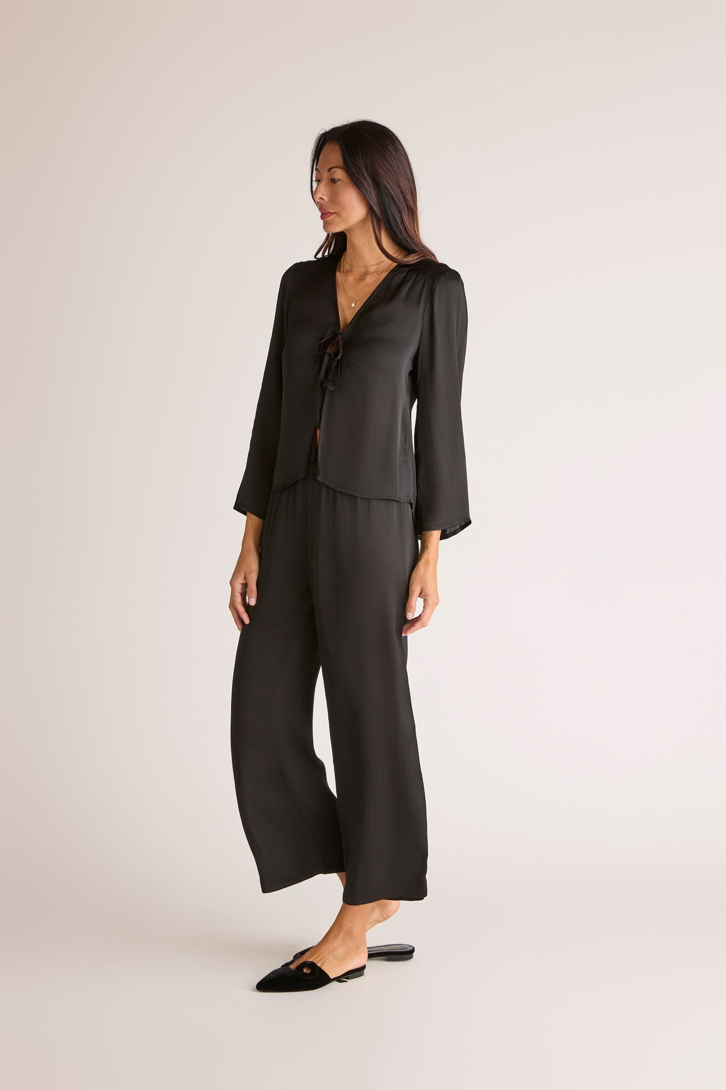 The Solune Muse Set Black — women’s black satin vacation set with soft drape blouse and relaxed wide-leg pants